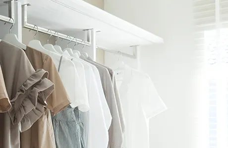 clothes hanging in closet.