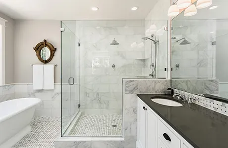 bathroom with glass enclosed shower.