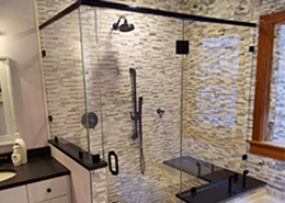 A picture of a walk in shower with newly installed glass.