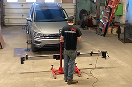 A Portland Glass technician testing a vehicle's ADAS Windshield Calibration.