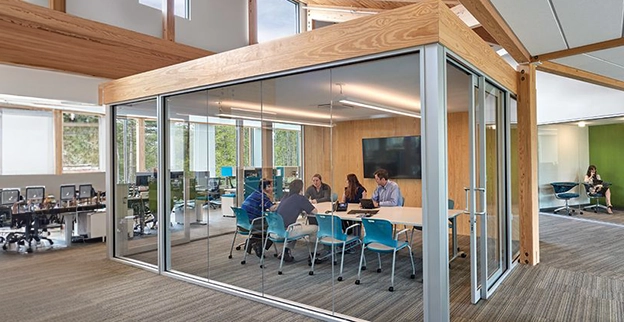A conference room with a glass wall on four sides.