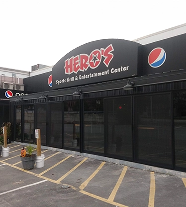 A restaurant storefront with glass windows.