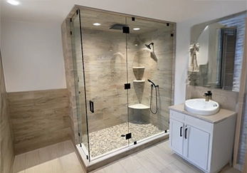 Floor to Ceiling Glass Shower with Black Hardware.