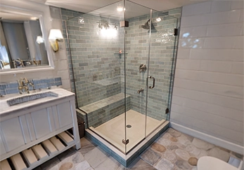 Frameless Glass Shower with brushed nickel Hardware.