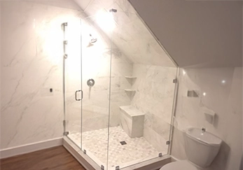 Custom Glass Shower for Sloped Ceilings with Frameless Design.