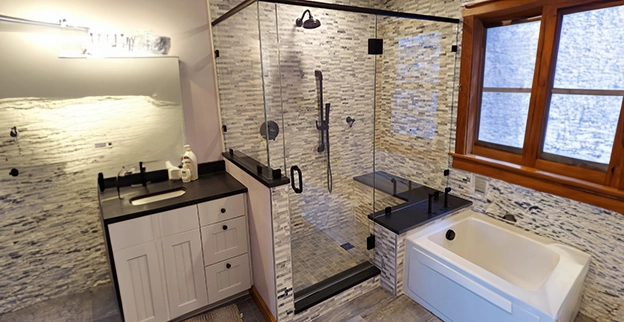 A picture of a semi-frameless glass shower enclosure.