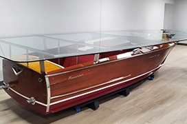 A picture of a glass tabletop over boat converted into a coffee table.
