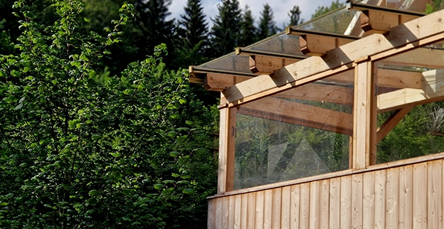 A patio sunroom with plastic windows.