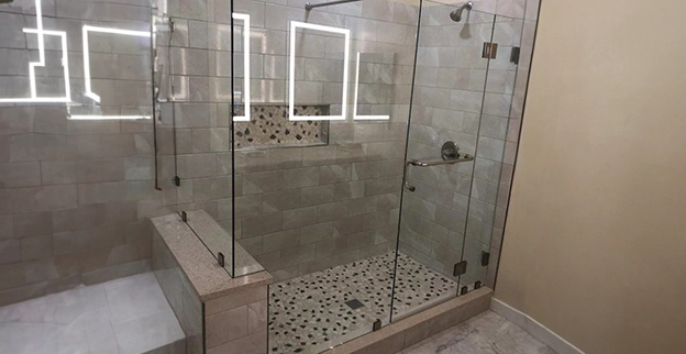 A picture of a frameless glass shower enclosure.