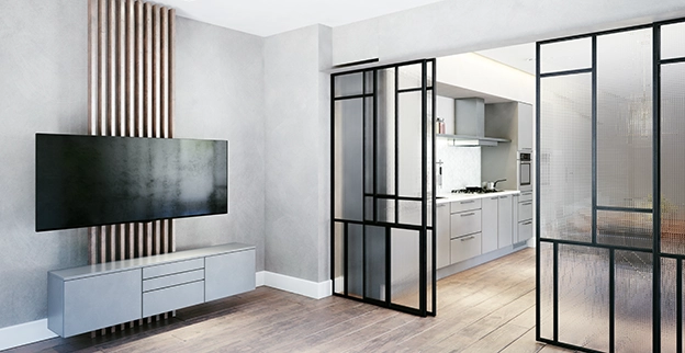 A picture of a sliding glass door separating two rooms in a home.