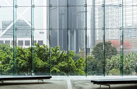 glass wall with view of the city.